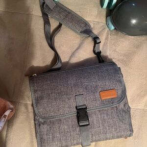 Portable diaper changing pad. Holds diapers and wipes as well